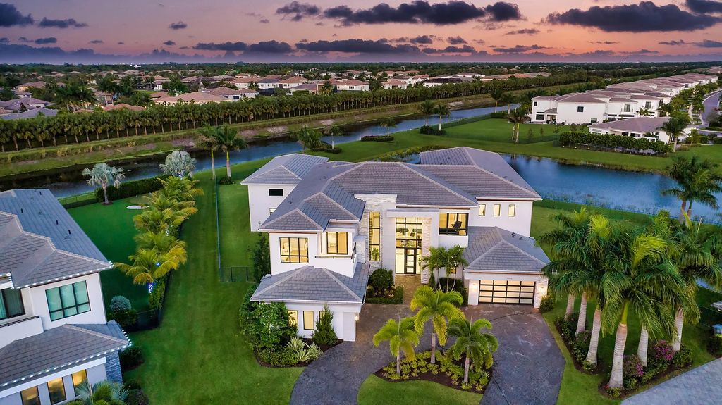 17055 Brulee Breeze Way, Boca Raton, Florida, is located in the heart of Boca Raton, Boca Bridges' centralized location, on an oversized 0.72 +- acre lot, which is the largest model offered at Boca Bridges. Integrating the sophisticated grandeur of resort-style living with family friendly amenities, this home offers a wide array of world-class amenities.