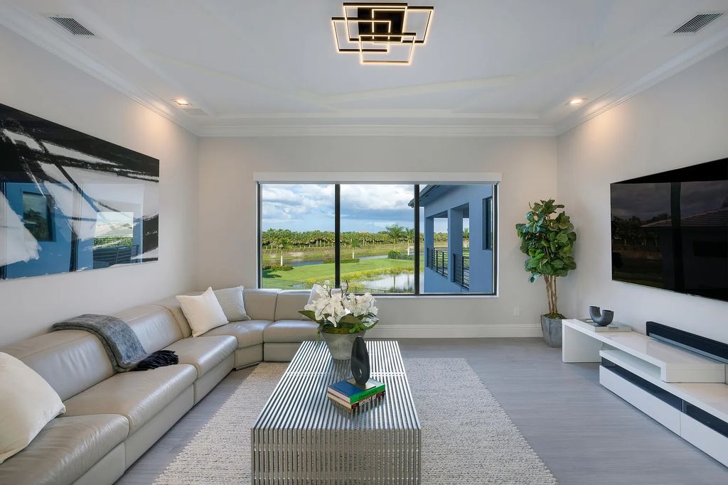 17055 Brulee Breeze Way, Boca Raton, Florida, is located in the heart of Boca Raton, Boca Bridges' centralized location, on an oversized 0.72 +- acre lot, which is the largest model offered at Boca Bridges. Integrating the sophisticated grandeur of resort-style living with family friendly amenities, this home offers a wide array of world-class amenities.