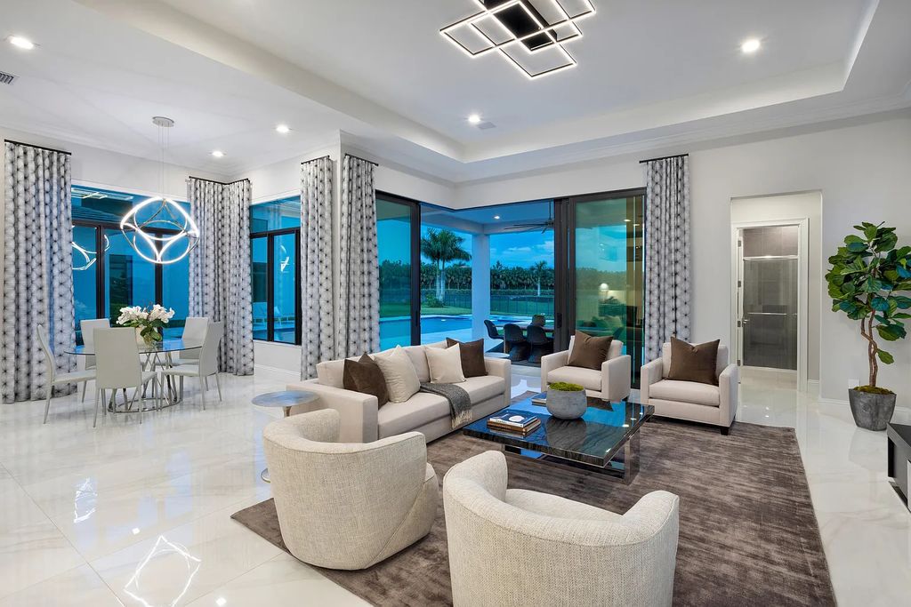 17055 Brulee Breeze Way, Boca Raton, Florida, is located in the heart of Boca Raton, Boca Bridges' centralized location, on an oversized 0.72 +- acre lot, which is the largest model offered at Boca Bridges. Integrating the sophisticated grandeur of resort-style living with family friendly amenities, this home offers a wide array of world-class amenities.