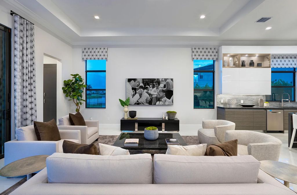 17055 Brulee Breeze Way, Boca Raton, Florida, is located in the heart of Boca Raton, Boca Bridges' centralized location, on an oversized 0.72 +- acre lot, which is the largest model offered at Boca Bridges. Integrating the sophisticated grandeur of resort-style living with family friendly amenities, this home offers a wide array of world-class amenities.