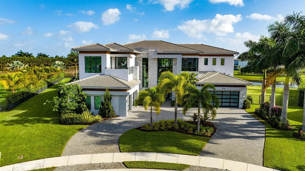 17055 Brulee Breeze Way, Boca Raton, Florida, is located in the heart of Boca Raton, Boca Bridges' centralized location, on an oversized 0.72 +- acre lot, which is the largest model offered at Boca Bridges. Integrating the sophisticated grandeur of resort-style living with family friendly amenities, this home offers a wide array of world-class amenities.