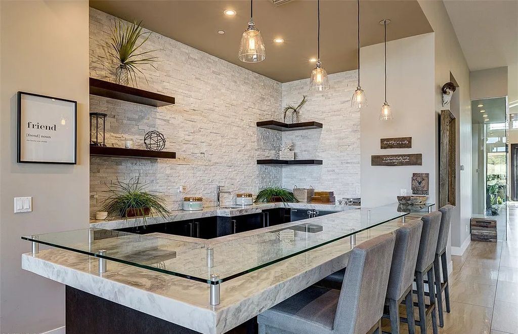 1376 Opal Valley Street, Henderson, Nevada is a retreat of all retreats located in Seven Hills on Rio Secco's 17th fairway featuring an amazing great room with true indoor/outdoor living, massive kitchen.