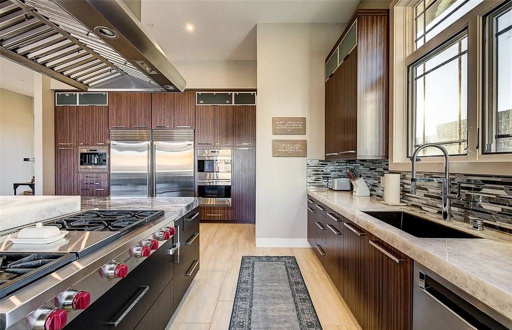 1376 Opal Valley Street, Henderson, Nevada is a retreat of all retreats located in Seven Hills on Rio Secco's 17th fairway featuring an amazing great room with true indoor/outdoor living, massive kitchen.