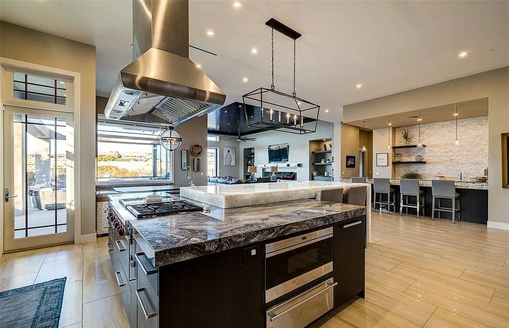 1376 Opal Valley Street, Henderson, Nevada is a retreat of all retreats located in Seven Hills on Rio Secco's 17th fairway featuring an amazing great room with true indoor/outdoor living, massive kitchen.