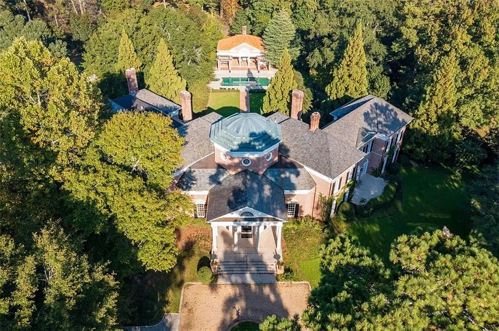 The Estate in Atlanta is a luxurious home designed for entertaining while providing developing options of the land investment in the future now available for sale. This home located at 825 Davis Dr, Atlanta, Georgia; offering 07 bedrooms and 11 bathrooms with 14,847 square feet of living spaces.
