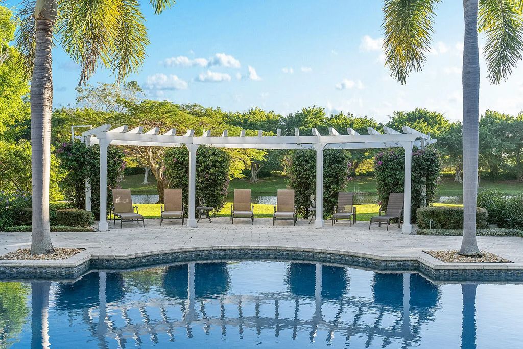 6030 Le Lac Road, Boca Raton, Florida, designed by award-winning architect Randall Stofft, is an exquisite lakefront estate located on 2.13 acres of meticulously manicured grounds within Boca Raton's most prestigious neighborhoods.