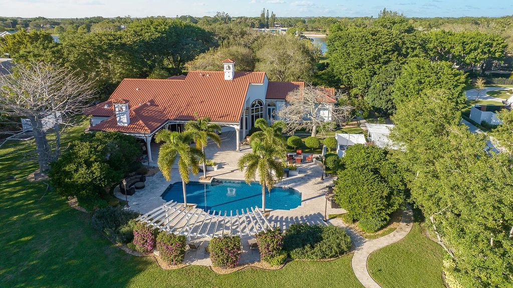 6030 Le Lac Road, Boca Raton, Florida, designed by award-winning architect Randall Stofft, is an exquisite lakefront estate located on 2.13 acres of meticulously manicured grounds within Boca Raton's most prestigious neighborhoods.