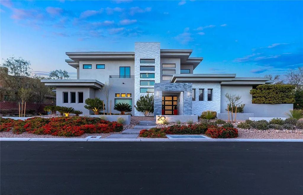 20 Skybird Court, Las Vegas, Nevada is a fully remodeled gem in the enclave of Redhawk behind the guard gates of The Ridges boasting a basketball area, pool with water slide and oversized wet deck, an indoor/outdoor bar, firepit, outdoor kitchen with ceiling mounted infrared heaters, and a wine cellar.