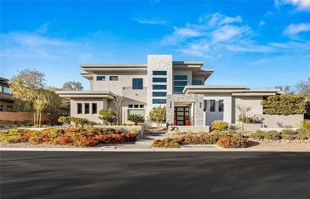 20 Skybird Court, Las Vegas, Nevada is a fully remodeled gem in the enclave of Redhawk behind the guard gates of The Ridges boasting a basketball area, pool with water slide and oversized wet deck, an indoor/outdoor bar, firepit, outdoor kitchen with ceiling mounted infrared heaters, and a wine cellar.