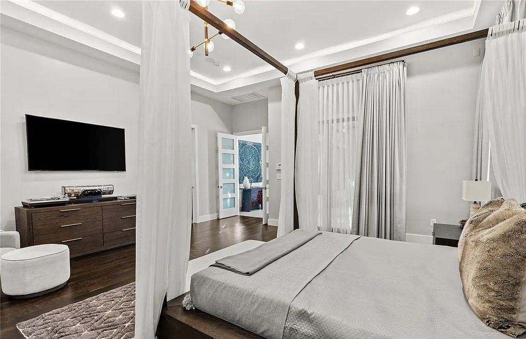 20 Skybird Court, Las Vegas, Nevada is a fully remodeled gem in the enclave of Redhawk behind the guard gates of The Ridges boasting a basketball area, pool with water slide and oversized wet deck, an indoor/outdoor bar, firepit, outdoor kitchen with ceiling mounted infrared heaters, and a wine cellar.