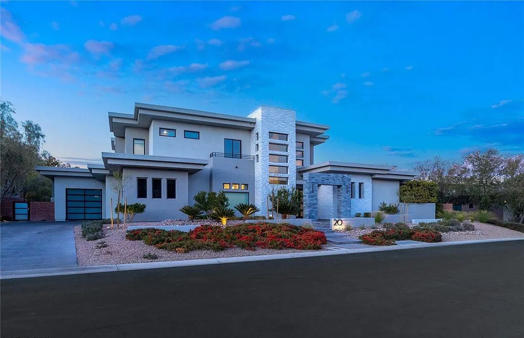 20 Skybird Court, Las Vegas, Nevada is a fully remodeled gem in the enclave of Redhawk behind the guard gates of The Ridges boasting a basketball area, pool with water slide and oversized wet deck, an indoor/outdoor bar, firepit, outdoor kitchen with ceiling mounted infrared heaters, and a wine cellar.