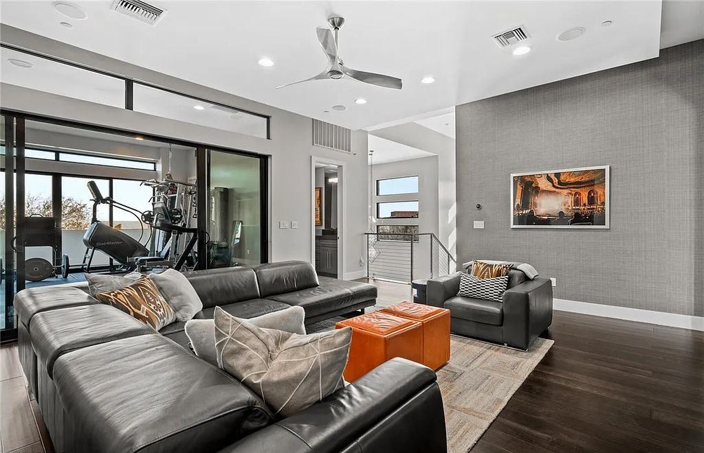 20 Skybird Court, Las Vegas, Nevada is a fully remodeled gem in the enclave of Redhawk behind the guard gates of The Ridges boasting a basketball area, pool with water slide and oversized wet deck, an indoor/outdoor bar, firepit, outdoor kitchen with ceiling mounted infrared heaters, and a wine cellar.