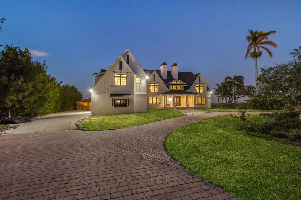 7814 Desoto Memorial Highway, Bradenton, Florida is an elegant Cape Cod styled manor was rebuilt in 2022 by Gagne Construction Idyllically poised at the mouth of the Manatee River, enjoy the natural beauty and spectacular water views.