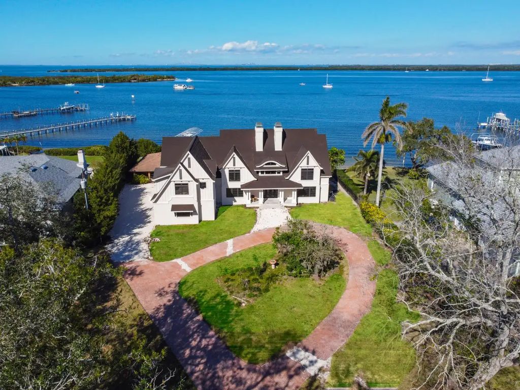 7814 Desoto Memorial Highway, Bradenton, Florida is an elegant Cape Cod styled manor was rebuilt in 2022 by Gagne Construction Idyllically poised at the mouth of the Manatee River, enjoy the natural beauty and spectacular water views.