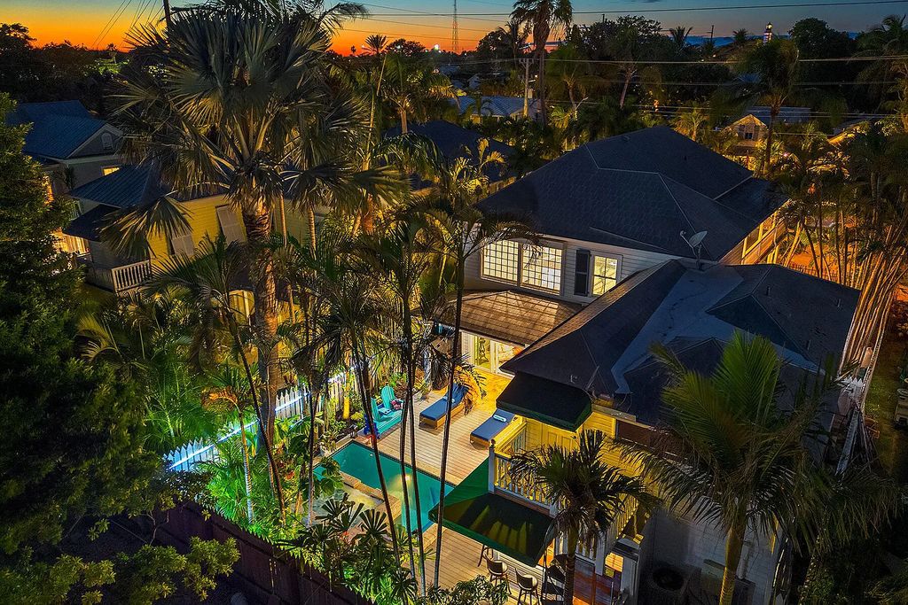 408 United Street, Key West, Florida, located in the most sought after location in Old Town, nestled between world famous Duval St & Whitehead St, mere steps to the beach, Southernmost Point, restaurants. This Trophy residence sits on a premium 5,109 sq ft lot, with abundant exotic tropical landscaping.