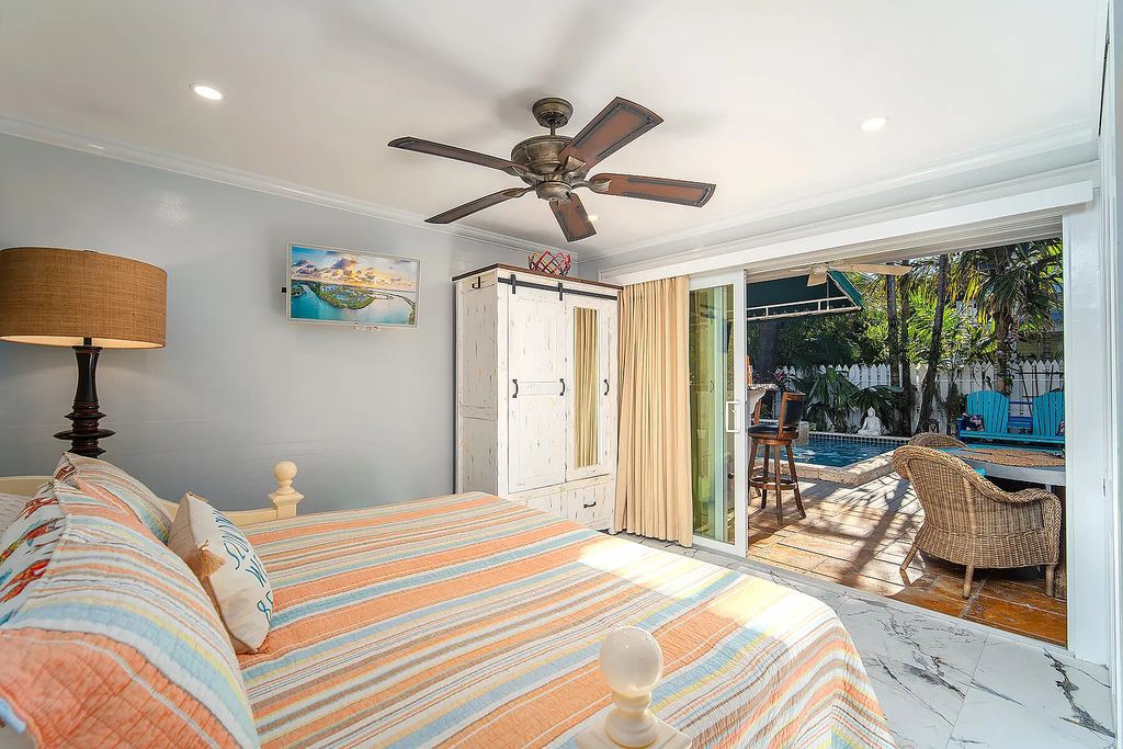 408 United Street, Key West, Florida, located in the most sought after location in Old Town, nestled between world famous Duval St & Whitehead St, mere steps to the beach, Southernmost Point, restaurants. This Trophy residence sits on a premium 5,109 sq ft lot, with abundant exotic tropical landscaping.