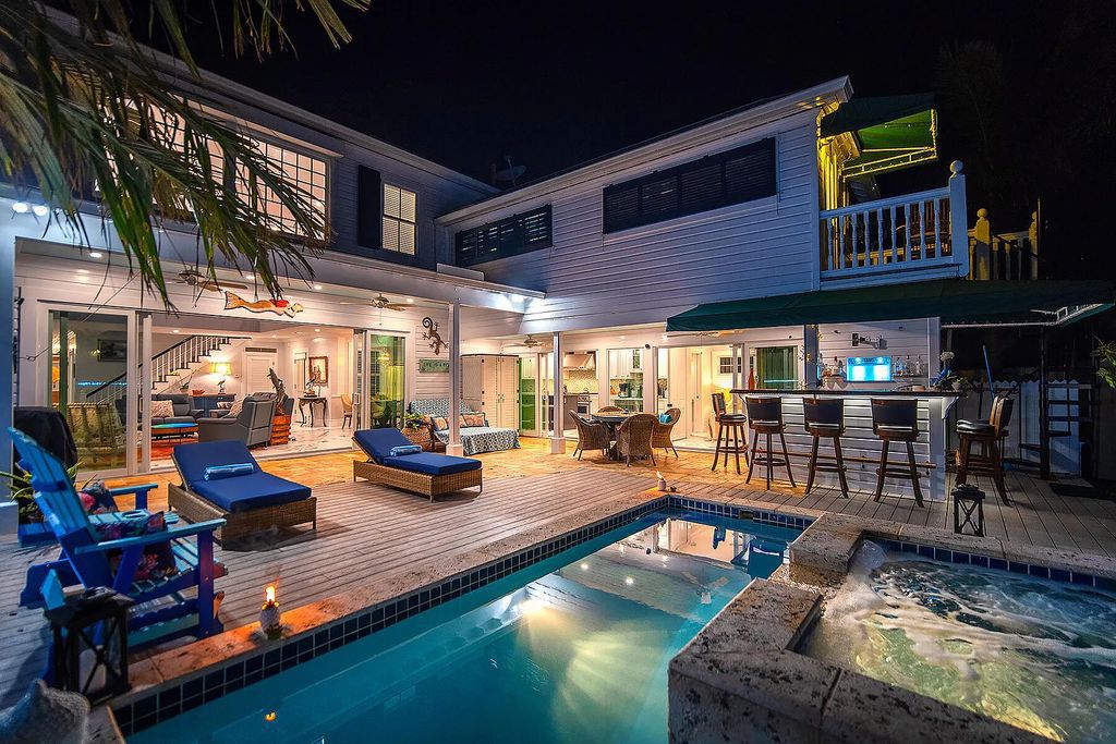 408 United Street, Key West, Florida, located in the most sought after location in Old Town, nestled between world famous Duval St & Whitehead St, mere steps to the beach, Southernmost Point, restaurants. This Trophy residence sits on a premium 5,109 sq ft lot, with abundant exotic tropical landscaping.