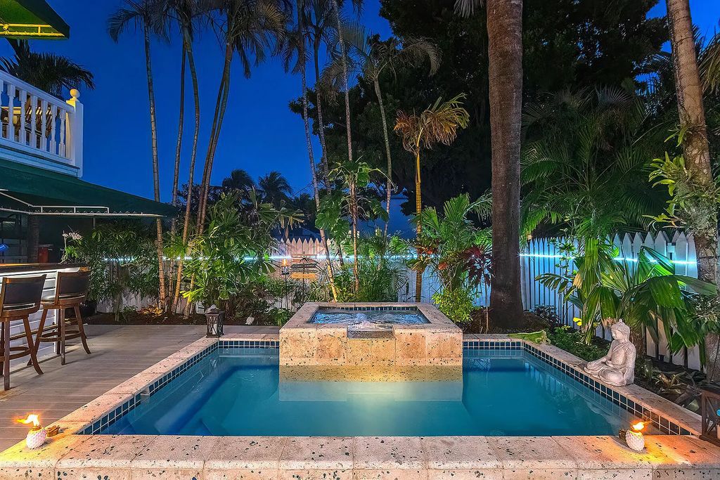408 United Street, Key West, Florida, located in the most sought after location in Old Town, nestled between world famous Duval St & Whitehead St, mere steps to the beach, Southernmost Point, restaurants. This Trophy residence sits on a premium 5,109 sq ft lot, with abundant exotic tropical landscaping.