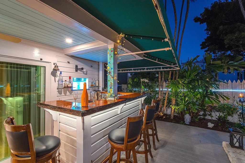 408 United Street, Key West, Florida, located in the most sought after location in Old Town, nestled between world famous Duval St & Whitehead St, mere steps to the beach, Southernmost Point, restaurants. This Trophy residence sits on a premium 5,109 sq ft lot, with abundant exotic tropical landscaping.