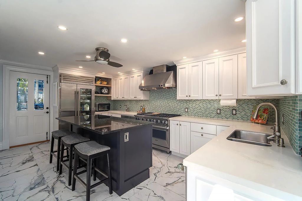408 United Street, Key West, Florida, located in the most sought after location in Old Town, nestled between world famous Duval St & Whitehead St, mere steps to the beach, Southernmost Point, restaurants. This Trophy residence sits on a premium 5,109 sq ft lot, with abundant exotic tropical landscaping.