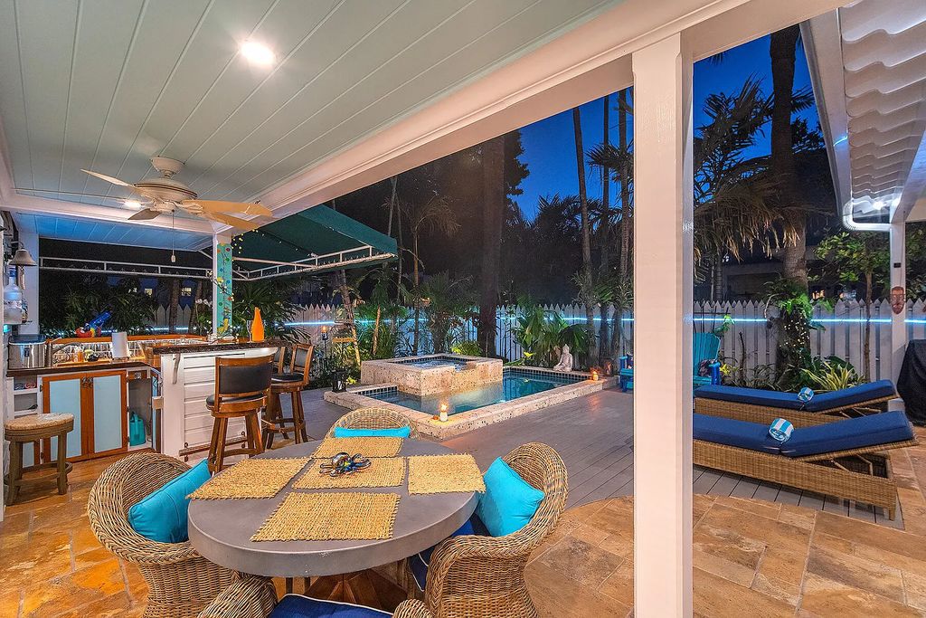 408 United Street, Key West, Florida, located in the most sought after location in Old Town, nestled between world famous Duval St & Whitehead St, mere steps to the beach, Southernmost Point, restaurants. This Trophy residence sits on a premium 5,109 sq ft lot, with abundant exotic tropical landscaping.