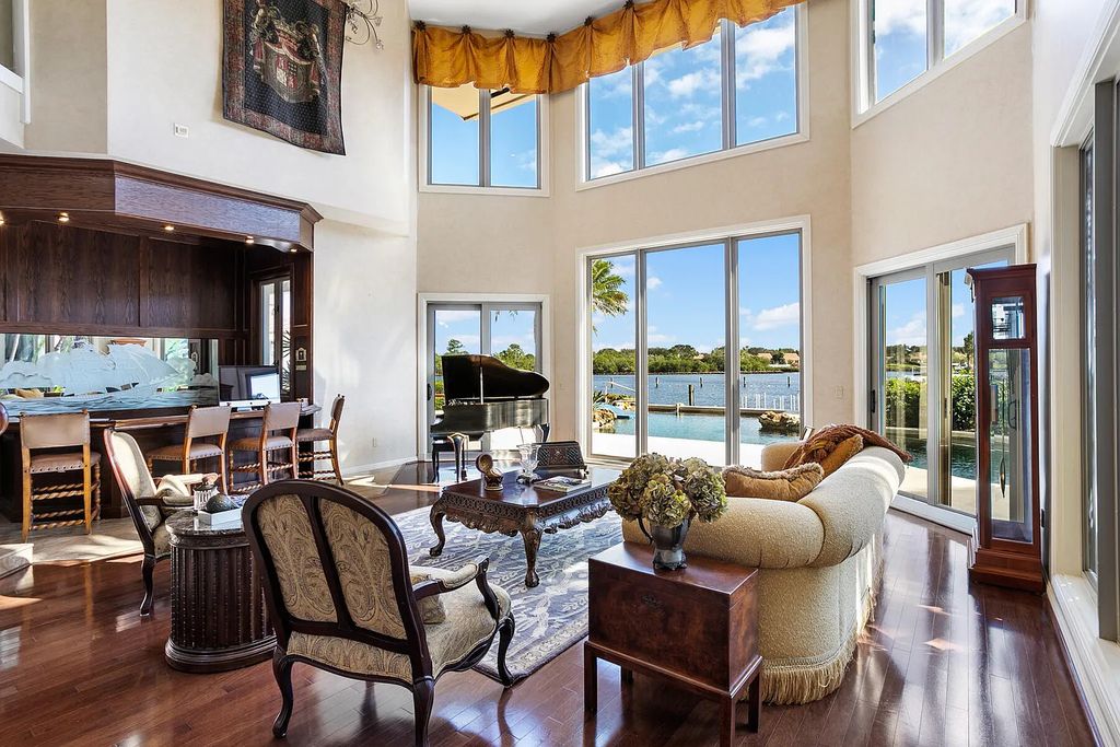 217 Commodore Drive, Jupiter, Florida is a stunning property sit on one of the largest water frontage lots on Commodore Island surrounded by new custom estates, a resort style pool with stunning orange sunsets and intracoastal activity.