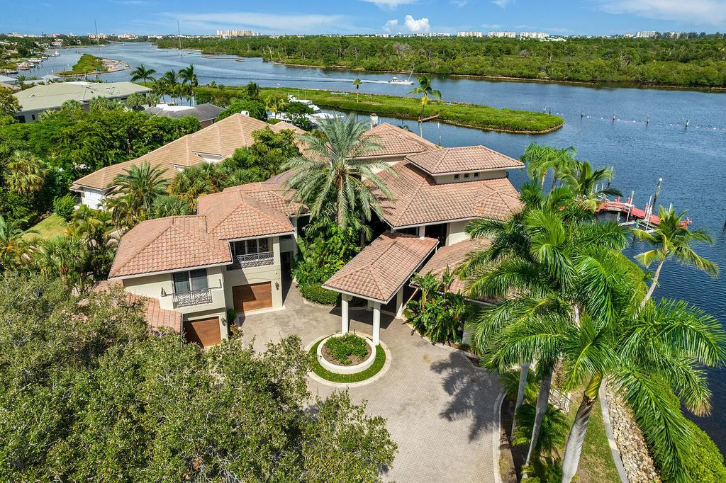 217 Commodore Drive, Jupiter, Florida is a stunning property sit on one of the largest water frontage lots on Commodore Island surrounded by new custom estates, a resort style pool with stunning orange sunsets and intracoastal activity.