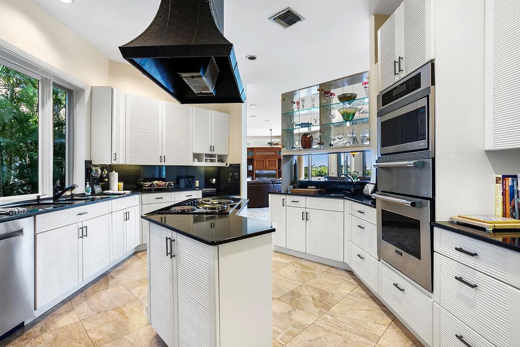 217 Commodore Drive, Jupiter, Florida is a stunning property sit on one of the largest water frontage lots on Commodore Island surrounded by new custom estates, a resort style pool with stunning orange sunsets and intracoastal activity.