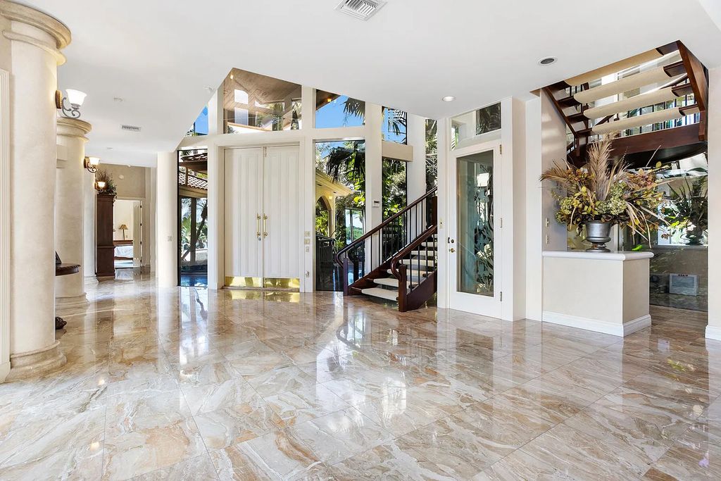 217 Commodore Drive, Jupiter, Florida is a stunning property sit on one of the largest water frontage lots on Commodore Island surrounded by new custom estates, a resort style pool with stunning orange sunsets and intracoastal activity.