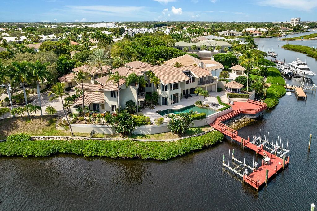 217 Commodore Drive, Jupiter, Florida is a stunning property sit on one of the largest water frontage lots on Commodore Island surrounded by new custom estates, a resort style pool with stunning orange sunsets and intracoastal activity.
