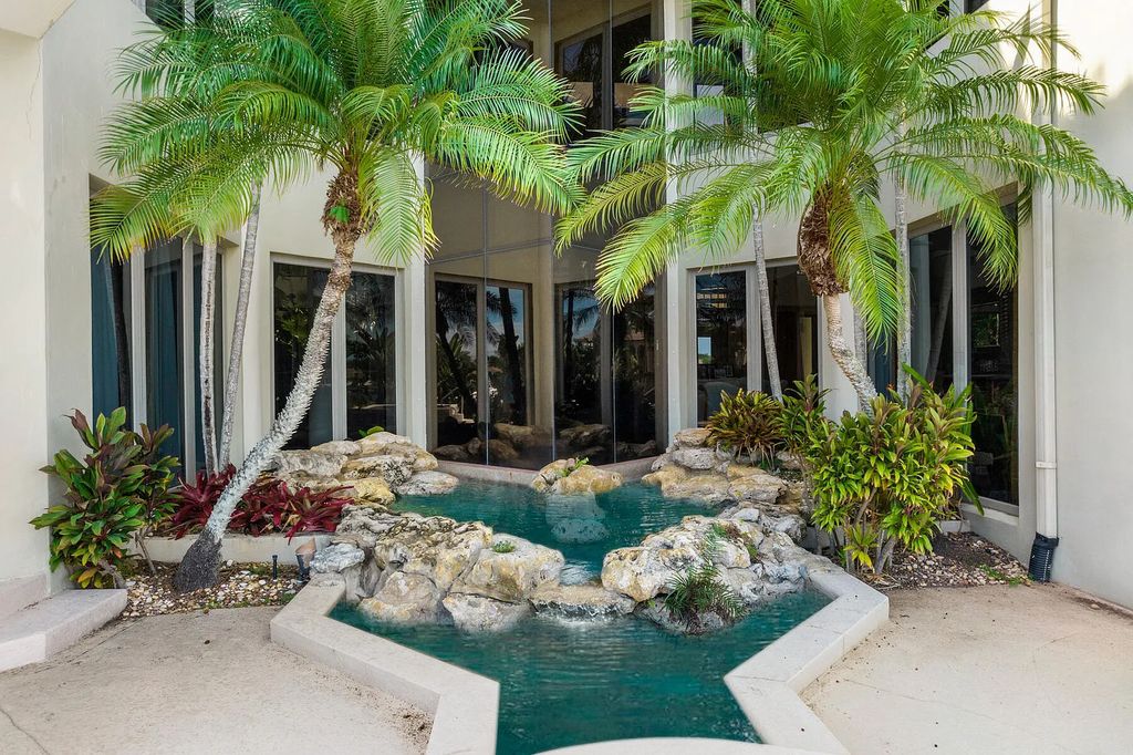 217 Commodore Drive, Jupiter, Florida is a stunning property sit on one of the largest water frontage lots on Commodore Island surrounded by new custom estates, a resort style pool with stunning orange sunsets and intracoastal activity.