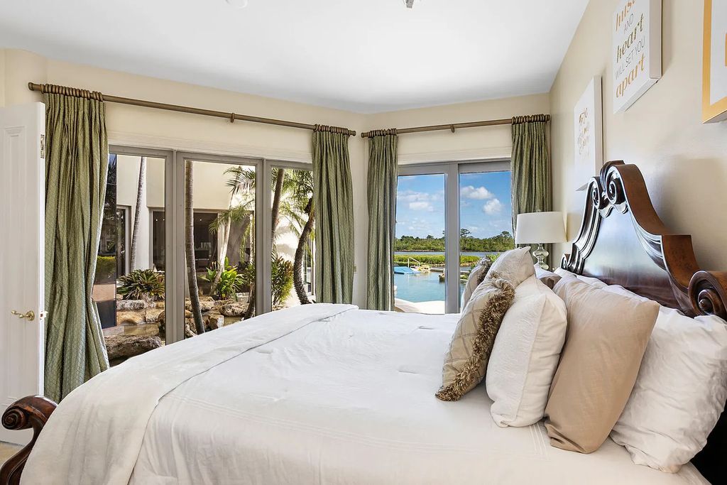 217 Commodore Drive, Jupiter, Florida is a stunning property sit on one of the largest water frontage lots on Commodore Island surrounded by new custom estates, a resort style pool with stunning orange sunsets and intracoastal activity.