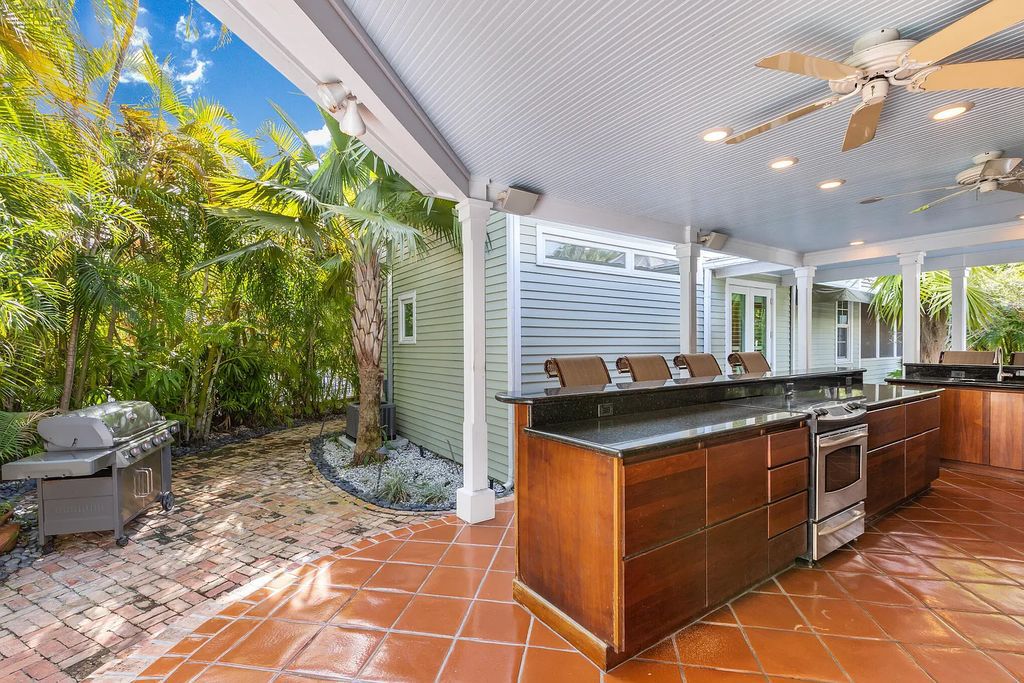 101 Admirals Lane, Key West, Florida,  provides privacy and a lush atmosphere for this remarkable home on a huge 14,000 SF lot, surrounded by a wall of tropical foliage. It is a spectacular property on one of the largest lots in the gated community of Truman Annex, featuring three separate dwellings blending traditional and contemporary architecture.