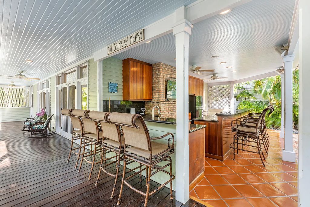 101 Admirals Lane, Key West, Florida,  provides privacy and a lush atmosphere for this remarkable home on a huge 14,000 SF lot, surrounded by a wall of tropical foliage. It is a spectacular property on one of the largest lots in the gated community of Truman Annex, featuring three separate dwellings blending traditional and contemporary architecture.