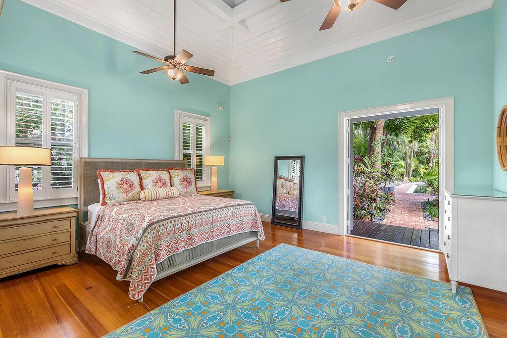 101 Admirals Lane, Key West, Florida,  provides privacy and a lush atmosphere for this remarkable home on a huge 14,000 SF lot, surrounded by a wall of tropical foliage. It is a spectacular property on one of the largest lots in the gated community of Truman Annex, featuring three separate dwellings blending traditional and contemporary architecture.
