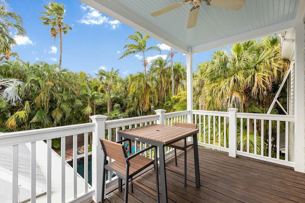 101 Admirals Lane, Key West, Florida,  provides privacy and a lush atmosphere for this remarkable home on a huge 14,000 SF lot, surrounded by a wall of tropical foliage. It is a spectacular property on one of the largest lots in the gated community of Truman Annex, featuring three separate dwellings blending traditional and contemporary architecture.
