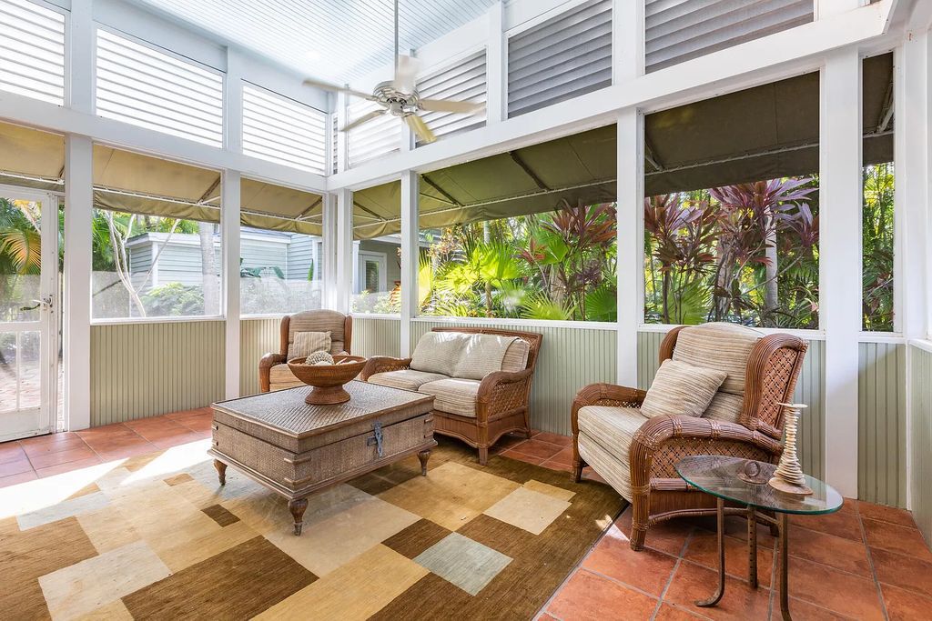 101 Admirals Lane, Key West, Florida,  provides privacy and a lush atmosphere for this remarkable home on a huge 14,000 SF lot, surrounded by a wall of tropical foliage. It is a spectacular property on one of the largest lots in the gated community of Truman Annex, featuring three separate dwellings blending traditional and contemporary architecture.