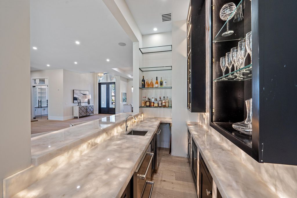 28901 Girard Terrace, Naples, Florida is an exceptional home was renovated from top to bottom and inside and out, features all new drywall, electrical, plumbing, new gas lines, new impact sliders and Anderson windows and doors plus a brand new roof. 