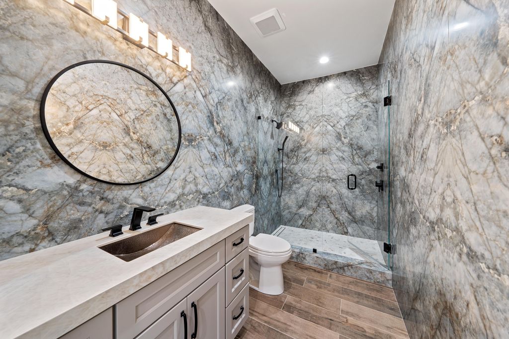 28901 Girard Terrace, Naples, Florida is an exceptional home was renovated from top to bottom and inside and out, features all new drywall, electrical, plumbing, new gas lines, new impact sliders and Anderson windows and doors plus a brand new roof. 