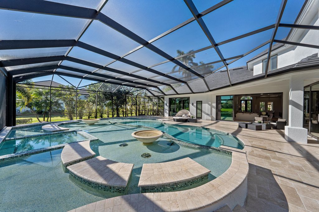 28901 Girard Terrace, Naples, Florida is an exceptional home was renovated from top to bottom and inside and out, features all new drywall, electrical, plumbing, new gas lines, new impact sliders and Anderson windows and doors plus a brand new roof. 