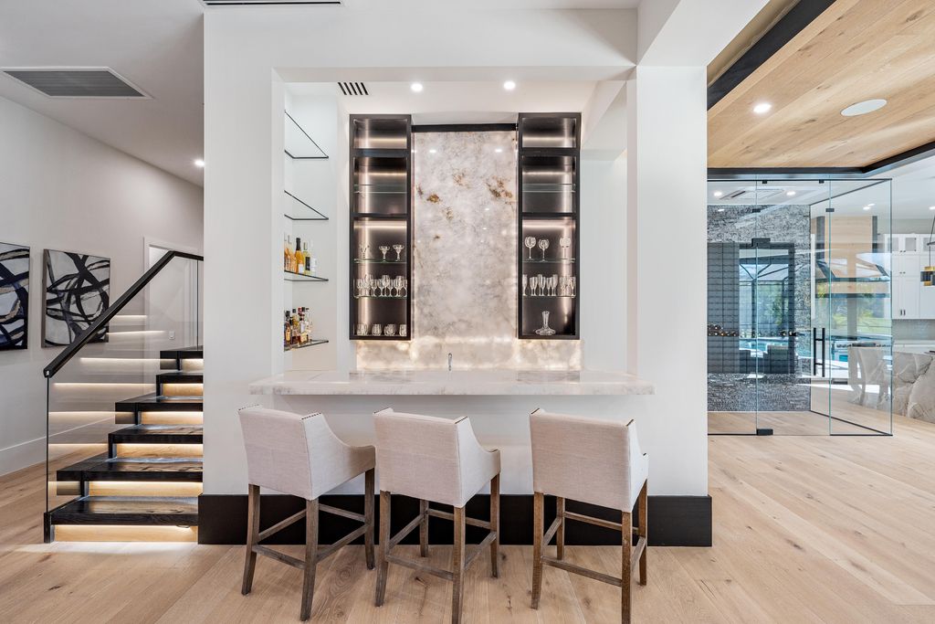 28901 Girard Terrace, Naples, Florida is an exceptional home was renovated from top to bottom and inside and out, features all new drywall, electrical, plumbing, new gas lines, new impact sliders and Anderson windows and doors plus a brand new roof. 