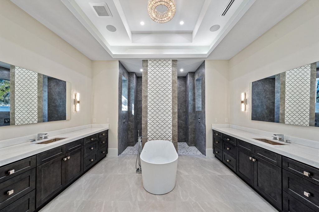 28901 Girard Terrace, Naples, Florida is an exceptional home was renovated from top to bottom and inside and out, features all new drywall, electrical, plumbing, new gas lines, new impact sliders and Anderson windows and doors plus a brand new roof. 