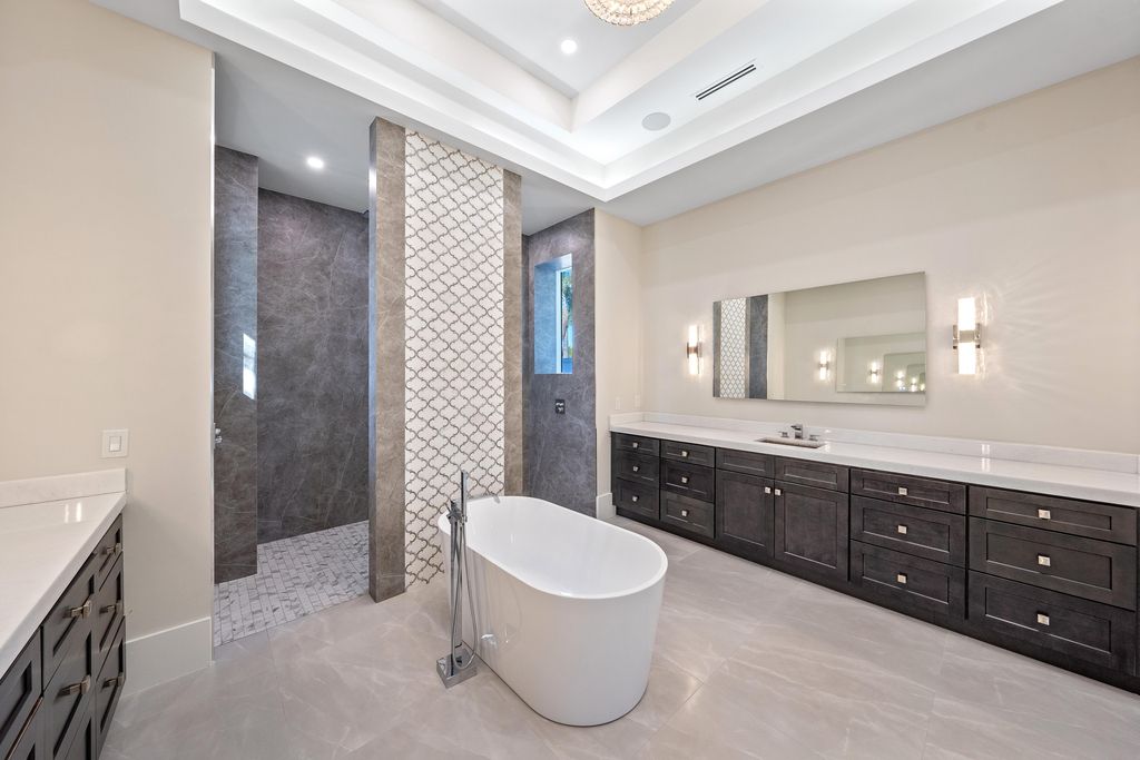 28901 Girard Terrace, Naples, Florida is an exceptional home was renovated from top to bottom and inside and out, features all new drywall, electrical, plumbing, new gas lines, new impact sliders and Anderson windows and doors plus a brand new roof. 