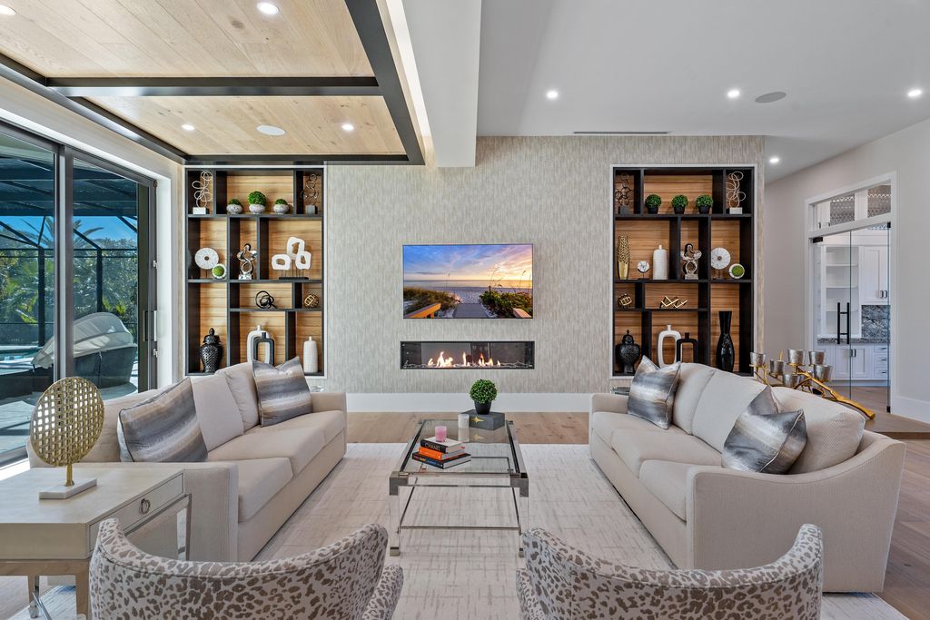 28901 Girard Terrace, Naples, Florida is an exceptional home was renovated from top to bottom and inside and out, features all new drywall, electrical, plumbing, new gas lines, new impact sliders and Anderson windows and doors plus a brand new roof. 