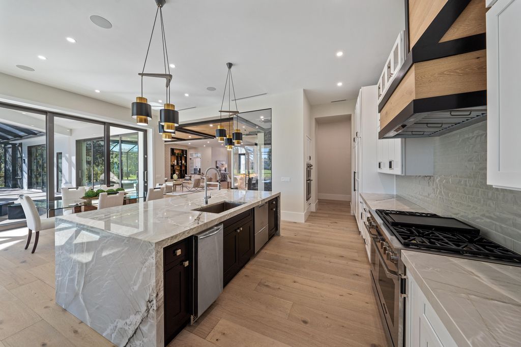 28901 Girard Terrace, Naples, Florida is an exceptional home was renovated from top to bottom and inside and out, features all new drywall, electrical, plumbing, new gas lines, new impact sliders and Anderson windows and doors plus a brand new roof. 