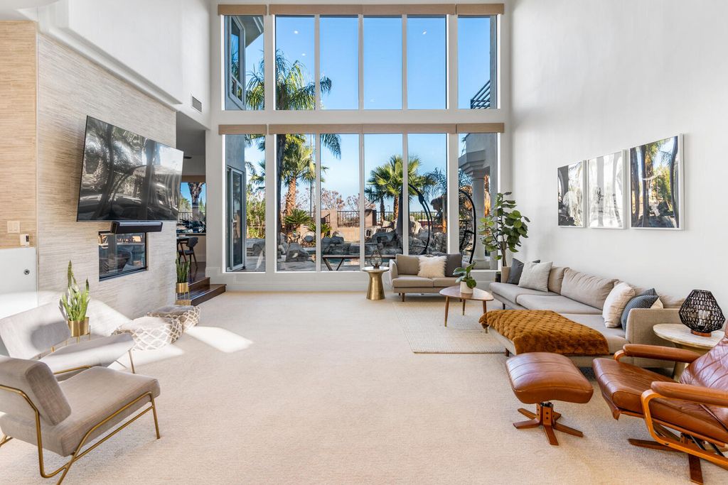 2000 Bogart Court, Las Vegas, Nevada is a one of a kind home situated on a cul-de-sac inside a private gated community featuring stunning finishes throughout with Limestone and hardwood flooring, quartzite fireplace, motorized window shades and grand 24” foot ceilings.