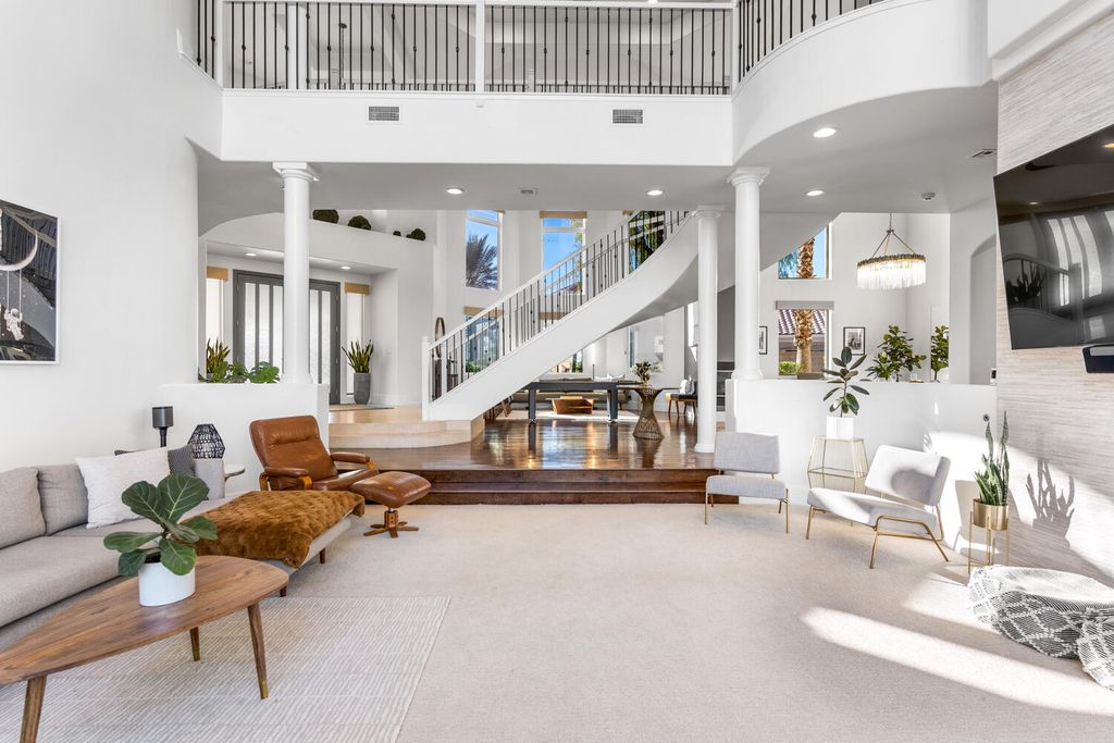 2000 Bogart Court, Las Vegas, Nevada is a one of a kind home situated on a cul-de-sac inside a private gated community featuring stunning finishes throughout with Limestone and hardwood flooring, quartzite fireplace, motorized window shades and grand 24” foot ceilings.