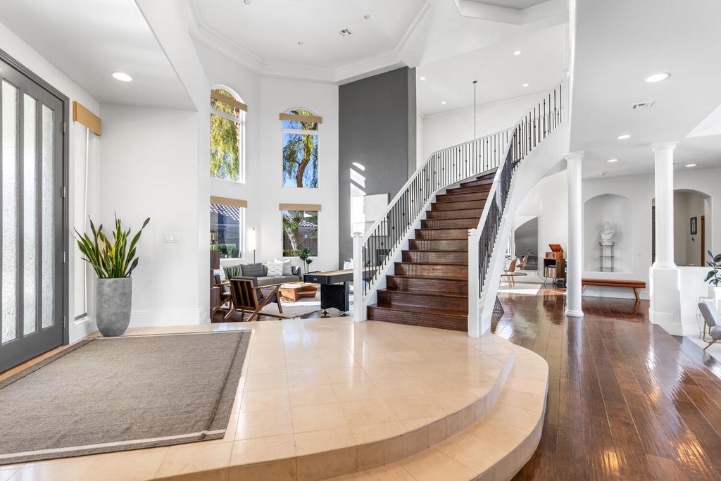 2000 Bogart Court, Las Vegas, Nevada is a one of a kind home situated on a cul-de-sac inside a private gated community featuring stunning finishes throughout with Limestone and hardwood flooring, quartzite fireplace, motorized window shades and grand 24” foot ceilings.