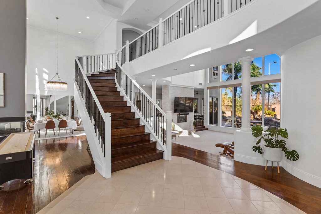 2000 Bogart Court, Las Vegas, Nevada is a one of a kind home situated on a cul-de-sac inside a private gated community featuring stunning finishes throughout with Limestone and hardwood flooring, quartzite fireplace, motorized window shades and grand 24” foot ceilings.