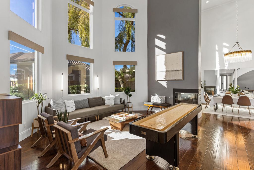 2000 Bogart Court, Las Vegas, Nevada is a one of a kind home situated on a cul-de-sac inside a private gated community featuring stunning finishes throughout with Limestone and hardwood flooring, quartzite fireplace, motorized window shades and grand 24” foot ceilings.